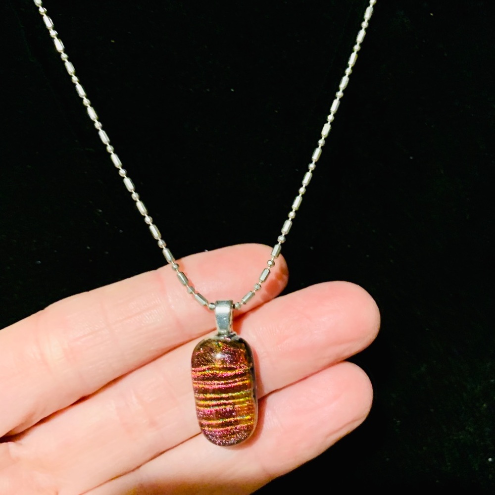 Silver chain necklace with orange design pendant
